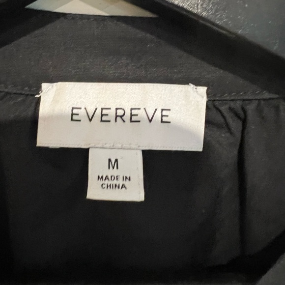 Black Short sleeved blouse with covered buttons and puff sleeves. - Picture 2 of 4